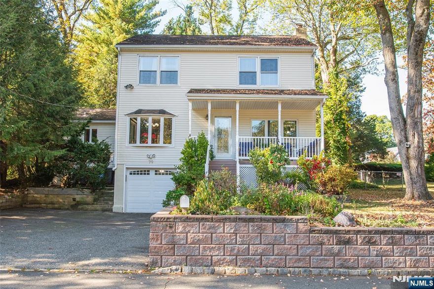 Welcome to this beautifully maintained 3 bedroom Colonial in impeccable condition. The home offers a large living room with wood burning stove and adjacent family room/flex space providing plenty of room for relaxation or home office. A gorgeous kitchen featuring a spacious center island - perfect for cooking, entertaining or gathering. SS appliances, recessed lighting. Multiple skylights are located on the first level. Enjoy special occasions in the formal dining room, ideal for hosting especially around the holidays. A full bath with heated floor is welcomed on a cool morning! The second level features a Primary Bedroom and 2 additional bedrooms, full bath and laundry room - a real treat!. Outside, unwind on the charming covered porch, the perfect spot for morning coffee or an evening glass of wine. This homes combines timeless Colonial charm with modern comforts - truly move-in ready. 3 zone central heat and central air, gas fired baseboard heat, newer furnace and how water heater (2024), lots of closets. A short walk to 2 schools (elementary and middle), and NJ Transit bus to New York City. Shopping, restaurants, Trader Joe's, Grocery Shops-....all close by.