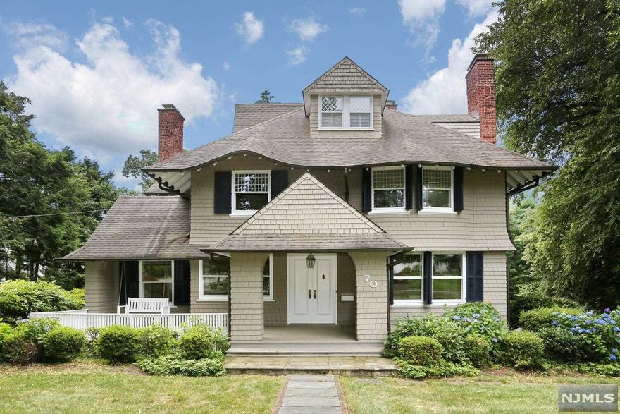 CLASSIC 5 BDRM, 3FULL/2HALF BTH CNTR HALL DUTCH COLONIAL W/CEDAR SHINGLES,4 FPLS,WIDE OPEN LEMONADE FRONT PORCH SITUATED ON 1AC+ OF PROPERTY IN THE RIDGEWOOD HEIGHTS. 1ST FLR HAS FRONT TO BACK LIVING RM W/FPL & LEADED GLASS FRENCH DOORS LEADS TO A LRG FMLY RM W/ A WALL OF BUILT-INS & FULL BAR.LARGE FORMAL DR W/ONE OF A KIND DELFT TILE SURROUNDING A DECORATIVE FPLC OPENS TO BUTLERS PANTRY FEATURES A COPPER SINK, PR, EIK ,BACK STAIRCASE & DOORS LEADING TO A DECK OVERLOOKING THE BACKYARD. THE 2ND FLR HAS PRIMARY BR WITH WIC W/BUILT-INS,UPDATED BTHRM & HIS/HER OVER SIZED CLOSET, THREE ADDL BEDROOMS, & HALL BATH. THE 3RD FLR FEATURES A 5TH BRM, FULL BTHRM & STORAGE AREA.PARTIALLY FINISHED BSMNT W/LNDRY RM,PR,REC RM,& ACCESS TO THE 1.5 ATTACHED GARAGE (2 CAR DETACHED GARAGE IS ALSO ACCESSED BY THE DRIVEWAY) A UNIQUE OPPORTUNITY TO LIVE MINUTES TO NYC TRAINS,SCHOOLS, PARKS, SHOPS & DINING!