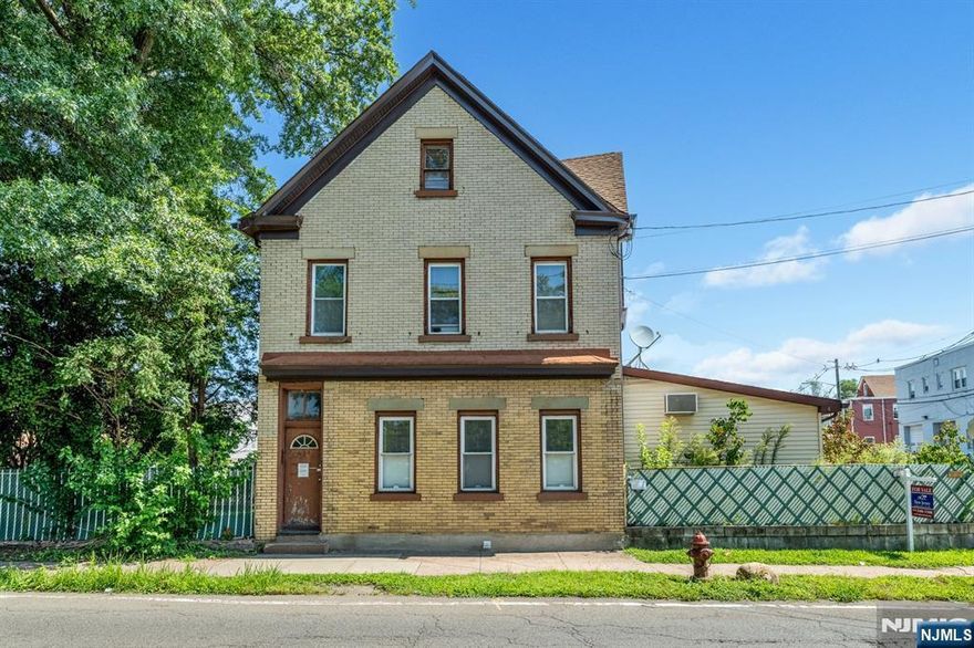 Spacious 2nd floor apartment featuring an eat-in kitchen, living room, 3 bedrooms, and 1 full bath, plus two additional rooms and a second full bath on the 3rd level. Washer/dryer hookups available. Two parking spaces included.