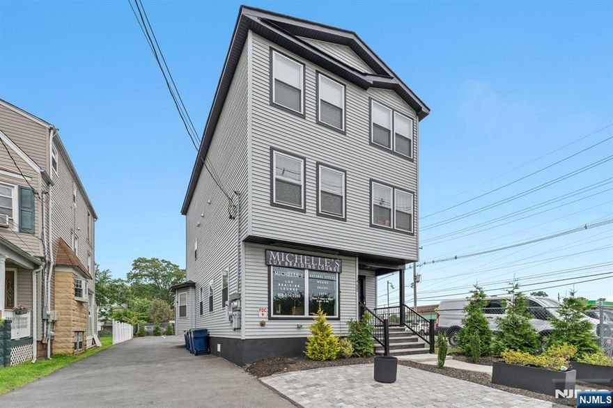 Unmatched Opportunity! Don't miss your chance to own this newer construction property, fully gut-renovated and expanded less than 3 years ago. Situated on a massive 5,319 sqft lot with parking for over 10 vehicles. The ground level features a commercial space previously owner-occupied that will be delivered vacant, ideal for a variety of business uses. The second and third floors are identical residential units, each offering 2 spacious bedrooms, 2 full bathrooms, and a private master suite for added luxury. Both units include in-unit washer/dryer hookups and beautifully designed kitchens with modern finishes and quartz island countertops. With excellent street visibility, this property is perfect for generating both commercial and residential rental income. Conveniently located near a major shopping hub that includes Home Depot, BJ's, TJ Maxx, Target, Walmart, and more.