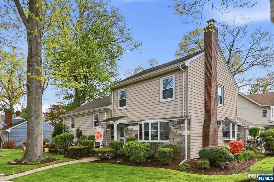 Welcome Home! Set back amid manicured landscaping This Split-level home offers exceptional curb appeal, sitting on a 100x113 level corner lot. This inviting 4-bedroom 3-bath home offers the perfect blend of comfort, character, and location. The spacious Sun-drenched living rm offers a wood burning fireplace Hardwood floors flow effortlessly into the dining rm. Modern Kitchen with newer stainless appliances, granite countertops. 2nd level offers original primary bedroom w/bath, Bedroom, Bedroom and main bath. 3rd level offers an expanded Primary Suite with Full Bath, Walk in Closet. Lower level offers family room, laundry room 1/2/bath and a workshop Enjoy quiet mornings or cozy evenings in the Sunroom a true extension of the living space that brings the outdoors in. Step out onto your patio perfect for entertaining amidst beautifully landscaped surroundings. An oasis for entertaining and relaxation. The fenced backyard is ideal for pets and offers space to garden, Attached is an oversized garage.