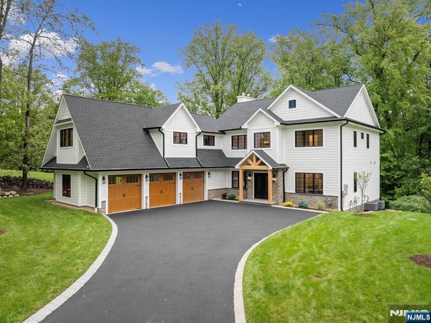 Tucked away at the end of a peaceful cul-de-sac and backing onto lush woods, this new construction (new foundation) home embodies the perfect blend of modern luxury and calming comfort. Imagine sipping your morning coffee while soaking in breathtaking views that change with every season. Step inside and youâ€™ll be greeted by a dazzling luxury kitchen that features a generous island and open concept floor plan, making it the ideal setting for gatherings and the bustle of everyday life. You'll appreciate the functionality of the space and enjoy the backdrop of stunning vistas. Retreat to your expansive primary suite where youâ€™ll bask in the warmth of radiant heat during chilly winter months, and enjoy his and hers closets. But the allure doesnâ€™t stop there! Head down to the impressive walk-out lower levelâ€”a versatile space just waiting to be transformed to fit your lifestyle. With a dry bar, an additional bedroom, and a full bath, itâ€™s perfect for hosting guests, an older child or indulging in entertainment. The stunning views are framed by a wall of windows. Step outside onto the deck or lower-level covered porch, where the beauty of the outdoors awaits. Imagine unwinding here, feeling your blood pressure drop as you immerse yourself in the tranquility that only nature can provide. All this plus a first floor bedroom offering the ability to live on one floor if needed. This isnâ€™t just a home; it's a lifestyle. New home warranty applies. BE SURE TO WATCH THE VIDEO!