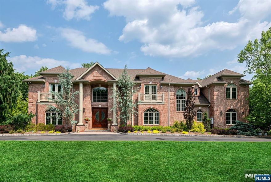 One of a kind custom all brick manor offering over 9K sq ft on 3 levels. This meticulously designed estate features a grand 2-story entry & elegant, light-filled living spaces. The heart of the home is a newly renovated dream kitchen w/ top-of-the-line appliances, butler's pantry w/ sink, wine fridge & large pantry, sunny breakfast rm, seamlessly opening to the family rm w/ FP. The 1st floor BR is perfect for guests with easy access to full bath & private entry. The banquet-size DR is perfect for hosting, while the library/home office w/ fireplace and built ins has direct access to the backyard. The oversized primary suite is a serene escape, complete w/ sitting room/coffee bar, 2 WICs, & spa-like bath. An additional 2nd sitting rm/office w/ FP complete the primary. 4 addâ€™l oversized ensuite BRs on the 2nd flr, a large laundry rm & back staircase. The dream finished lower lvl is designed for fun & function with an expansive custom wet bar, media area, billiard rm, gym, wine cellar w/ temp-controlled cabinets, wrapping room & ample custom closets. The rear yard is a private oasis featuring lush landscaping, custom pergola, outdoor kitch w/ seating, covered seated wet bar, sunken LR w/fire-pit & 20-person hot tub w/ built-in fire features, a spectacular setting for relaxation or gathering under the stars. Add'l amenities include radiant heat, generator, 3-car garage, circ DW, & easy NYC commute. Located in one of Bergen Countyâ€™s most desirable communities. Top-rated schools