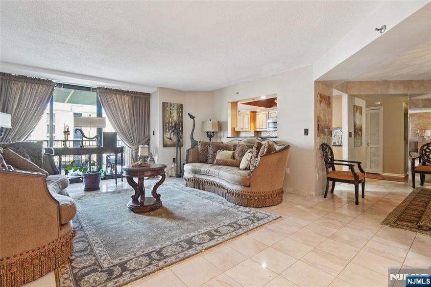 Discover Your Oasis at the Camelot High Rise Imagine a luxurious retreat where tranquility meets convenience, just minutes from NYC. This meticulously renovated condo in the exclusive Camelot High Rise is more than just a homeâ€”it's a lifestyle. Spanning over 1,600 square feet, this home offers an unparalleled sense of privacy with only four units per floor. The layout includes two generously sized bedrooms, one of which is a luxurious master suite. The eat-in kitchen is a true centerpiece, featuring a large dinette area perfect for casual dining and a breakfast bar that opens to a spacious living room. It's an ideal setup for entertaining guests or enjoying a quiet morning. Step out onto your expansive, room-sized terraceâ€”a perfect spot for a morning coffee or an evening cocktail while you take in the views. Enjoy year-round resort-style living with an indoor pool, a fully equipped fitness center, and an on-site tennis court. Commuting is a breeze with the NYC express bus just half a block away and the NYC train nearby. Plus, you get the convenience of two assigned garage parking spots. Experience sophisticated, serene living with a seamless commute to the city. This is your chance to own a piece of luxury in a prime location. Garage space # 105 & 247 Pets Prohibited. Rent Not Allowed