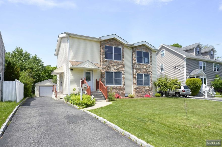 Wow! This amazingly spacious home is A Must See! Originally a ranch, this expanded custom home is now a Colonial offering 5 Full Bedrms, 2 Full Bathrms and a 1 car detached garage with additional carport. Oversized kitchen boasts granite countertops and plenty of prep space. The home features laminate flooring throughout as well as recessed lighting, multi zone heat and central air, and much more. The addition was completed 15 years ago, including the roof, furnace, central AC system, and Anderson windows throughout. The upstairs boasts a bonus living area with 3 skylights allowing for plenty of natural light plus a small study room, 3 additional bedrooms and a full bath. The basement is finished with a full laundry area, separate room which can be considered an additional office/bedroom with the space and capability of having a bathroom downstairs. Level Lot and backyard completes this perfect home to call your own! A wonderful neighborhood close to schools, shops, etc.