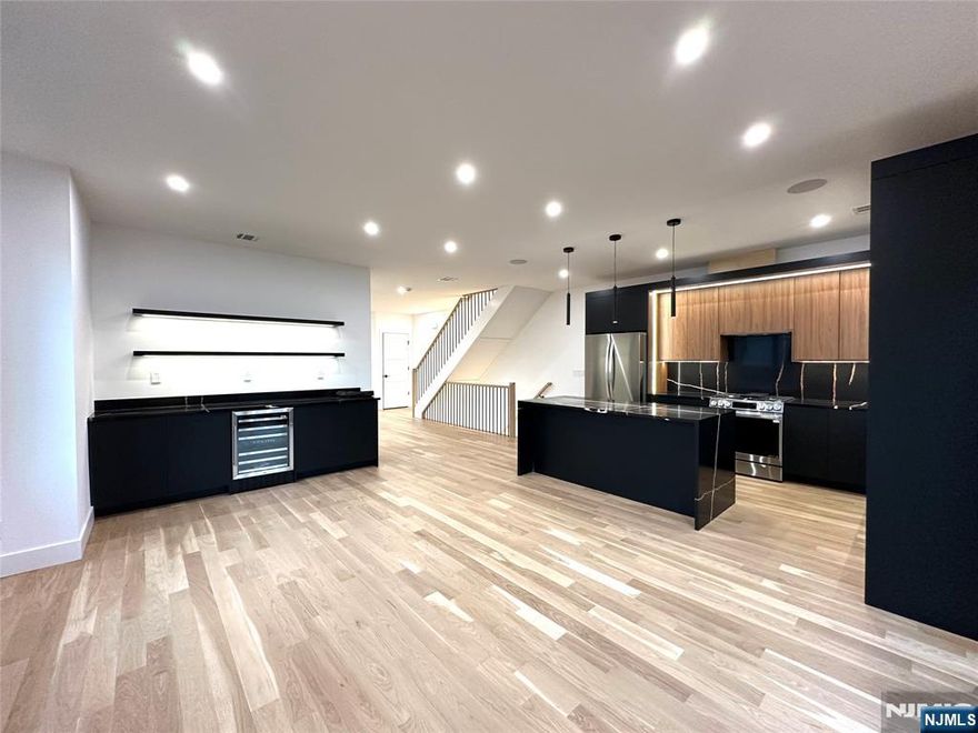 Welcome to 1 Casper Lane, a stunning 3,000 square-foot luxury home, where modern elegance meets cutting edge technology. Every detail has been thoughtfully designed, offering an exceptional living experience. Step inside & discover an open concept layout w/ smart home integration, allowing you to control lighting, thermostats, cameras, & speakers with ease. Sleek LED tape lighting throughout. Balcony access on the main level and top floor. The heart of the home is the fully custom-built kitchen, featuring high-end finishes, top-of-the-line appliances w/ plenty of storage space. The primary bathroom is a spa like retreat, offering a large shower with floor-to-ceiling tile and LED lighting. Dual vanities with lighted mirrors & a spa like floating tub. The expansive ground floor is fully tiled. Driveway lights & EV charging ready. All of this is just minutes away from the best Fort Lee has to offer shopping, dining & easy access to major highways. This is a home where luxury, comfort & innovation come together