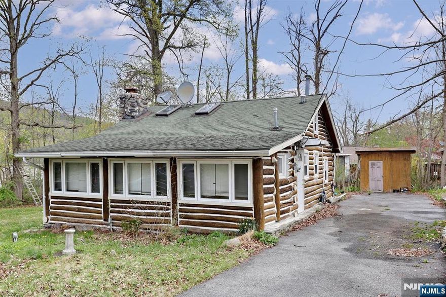 Location! Location!! Location!!! Cozy log cabin situated on approximately 0.23 acre (10,019 sq ft) and located less than 1/2 mile from ShopRite Shopping Center at the crossroads of Union Valley Rd & Marshall Hill Rd. Pinecliff Lake with available paid privileges and town center are just down the street. Offering 2 bedrooms, bathroom with laundry, living room with wood burning fireplace, and kitchen with adjacent dining area. In addition, vaulted ceiling reveals a loft with ample storage. Patio and shed in backyard with 3+ car driveway. Needing a little TLC, make this your getaway or construct your dream home!!!