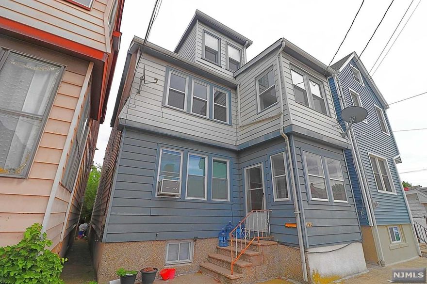 Welcome home to this charming two family. This home has it all; 5 bedrooms, 3 full baths, nice backyard space to entertain and beautiful original hardwood floors throughout. Upon entering the first duplex unit you will find a sun-drenched first floor featuring a comfortable living & dining room space, 4 year newer eat in kitchen with shaker cabinets, quartz countertops, island & full bathroom, along with the full finished basement with laundry area, full bathroom, bonus room and storage. The second units layout is similar to the first unit offering a 2 year new remodeled large duplex and finished bonus space on the third floor with 2-3 additional rooms! All separate utilities! Conveniently located next to transportation, shopping & parks. 1 block away from the bus stop on Belgrove to commute into NYC. Come see this Today!