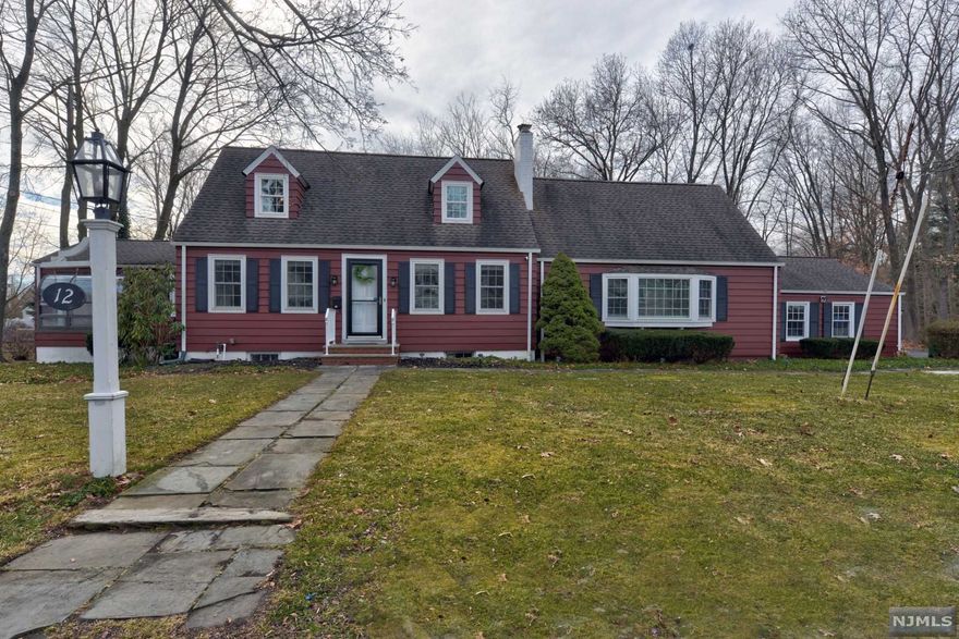 Location, Location! Nestled in one of the most prestigious neighborhoods in town, this oversized cape/colonial with over 2,300 sq ft of living space exemplifies the finest in traditional and contemporary features. Walk in to a stately dining room with wood burning fireplace that leads to a spacious family room adorned with custom built-ins for all your entertainment needs. The warmth of the living room leads to an updated eat-in-kitchen with center island and vaulted ceilings over the breakfast nook. A sun-filled den off of the kitchen provides an extra retreat. A 4th bedroom and powder room complete the main floor. The upstairs includes two bedrooms, an updated main bath and a newer primary suite addition that includes a new bath and walk-in closet. Enjoy year round relaxation in your backyard oasis with a newer hot tub, gorgeous paver patio and large private yard. This beautiful home offers so much living space, inside and out, for all your needs!