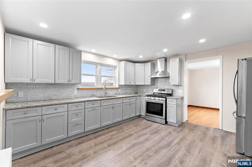 Welcome to 395 Palisade Ave, Unit #1 in Garfield. A spacious and inviting 3-bedroom, 1-bath home designed for comfortable living. This well-laid-out unit features a generous floor plan with ample natural light and room to spread out. The modern kitchen offers updated finishes, plenty of cabinet space, and a functional layout perfect for everyday cooking and entertaining. Each bedroom provides comfortable proportions and versatility for guests, a home office, or additional living space. Conveniently located near major highways for easy commuting and just minutes from the Plauderville Station, offering direct access to NYC and surrounding areas with ample street parking.Enjoy both accessibility and neighborhood charm in this ideally situated home with park right across the street. Schedule your showing today! Utilities Included (Electricity and Water)