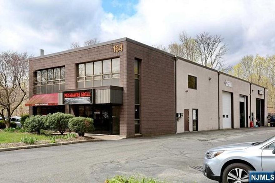 Amazing Mahwah Commercial Office and Garage/Warehouse for rent. Wonderful location. Immaculate carpeted office. Two desks can be left if you wish. Kitchenette. Heat pump and central A/C. Large Bathroom handicap fitted. Wait until you see this state of the art Garage/Warehouse. Soaring 20ft ceilings. Approximately 16 ft. Commercial Insulated Garage Door. New LED high efficiency lighting. Shelving units line the perimeter of the Garage. Units can be left or removed. 5 Parking Spaces included. Convenient to major highways. Don't miss this one of a kind unit.