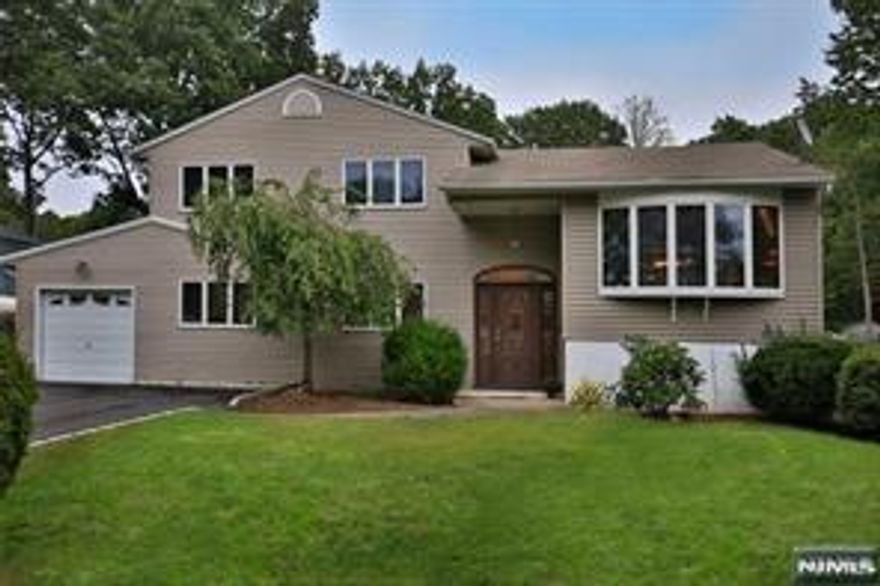 EXPANDED BEAUTIFUL HOME LOCATED IN DUMONT'S DESIRABLE WHITE BEECHES SECTION! SHORT TERM RENTAL! This fully furnished home has three nice size bedrooms, offering plenty of space with two full bathrooms! Recently renovated and hardwood floors throughout! The immaculate home is in move-in condition. The spacious floor plan has an open layout. With the kitchen flowing into both the living and dining room areas, giving you easy access to the outdoor deck overlooking the beautiful backyard!! The lower level has a large living area great for entertaining or enjoying relaxing moments with your family. This is a great opportunity to rent in a terrific location, close to schools, transportation, restaurants, shopping and 10 minutes to the George Washington Bridge to Manhattan! A must see!!