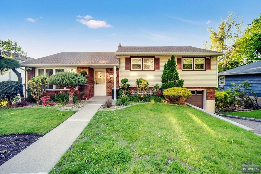 Lovely bright & sunny split level home in the desirable East Hill of Ridgefield. Move right into this well maintained 3 bedroom, 2.5 bath home perched on a large lot with magnificent views of The Ramapo Mountains and The Meadowlands. It offers updated eat in kitchen with granite counters, spacious living room, dining room, large backyard as well as a newer trek deck perfect for entertaining or just quietly enjoying the spectacular sunsets. Second level offers two bedrooms with a full bath as well as a primary bedroom with ensuite bath. The ground level has a rec room and bath that can be used for home office or guest room. There's a good size basement with high ceilings and access to the backyard which might be able to be finished for extended family or office. To top it off, the roof, windows, furnace and water heater have been updated. There's even a Home Generator! This home is one block from NJ Transit and near all highways, schools, shopping. Hurry before it's gone!!