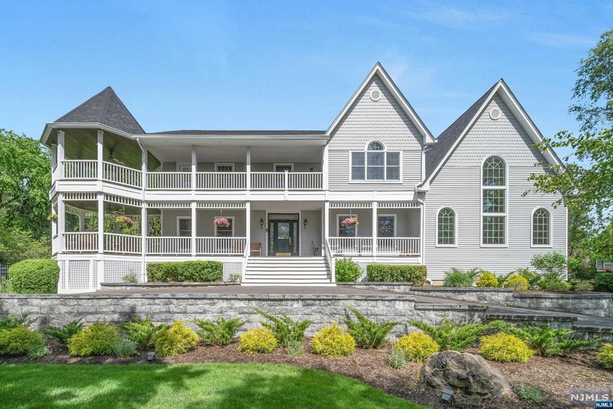 Timeless elegance and modern luxury in this exquisite 4 bedroom,4.5 baths home, nestled in a private setting at the end of a cul-de-sac. Breathtaking curb appeal, with its charming Victorian-style porches and meticulously landscaped gardens. Offering a blend of classic style and contemporary comfort. Enter through a grand foyer into expansive living spaces featuring high vaulted ceilings, elegant built-ins, and large windows that flood the rooms with natural light. The living room, adorned with a stone fireplace, provides a cozy yet sophisticated atmosphere for gatherings and entertaining. The modern kitchen is a chef's dream, including a large center island. The adjacent dining area, opens to a deck, perfect for barbecues and outdoor dining. The primary bedroom retreat is a private oasis featuring two walk-in closets, and luxurious bath. Beautiful rear grounds with a gunite in-ground pool. Owner holds a NJ real estate license