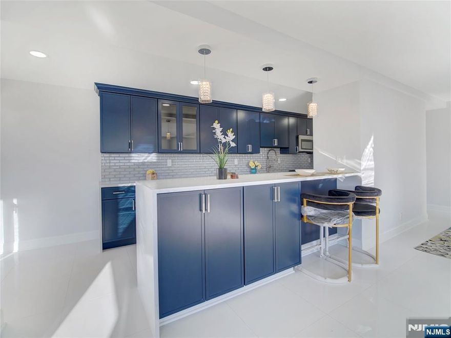 This gorgeous totally redone COOP is unlike any you have seen at Harrison Park Towers! This 8th-floor residence offers the same spacious layout and high-end renovation as the buildingâ€™s most in demand units. The custom blue kitchen cabinetry pairs with premium appliances and an open-concept galley design, including a built-in seating area for casual dining and entertaining. Features include three well-proportioned bedrooms, two newly renovated modern baths, and marble flooring throughout, delivering a polished and cohesive aesthetic. Building amenities include 24-hour concierge, all utilities included, underground parking ($60/month; one space available), NYC jitney, private garden, gym, and laundry. Convenient access to GSP and Route 280.Owner occupancy only. Co-op board approval requires at least. 20% down payment required. Ownership 433 shares | $2,087 monthly maintenance (includes taxes and all utilities - heat, hot water, sewer, water and electric). Square footage approximate. Come fall in love.