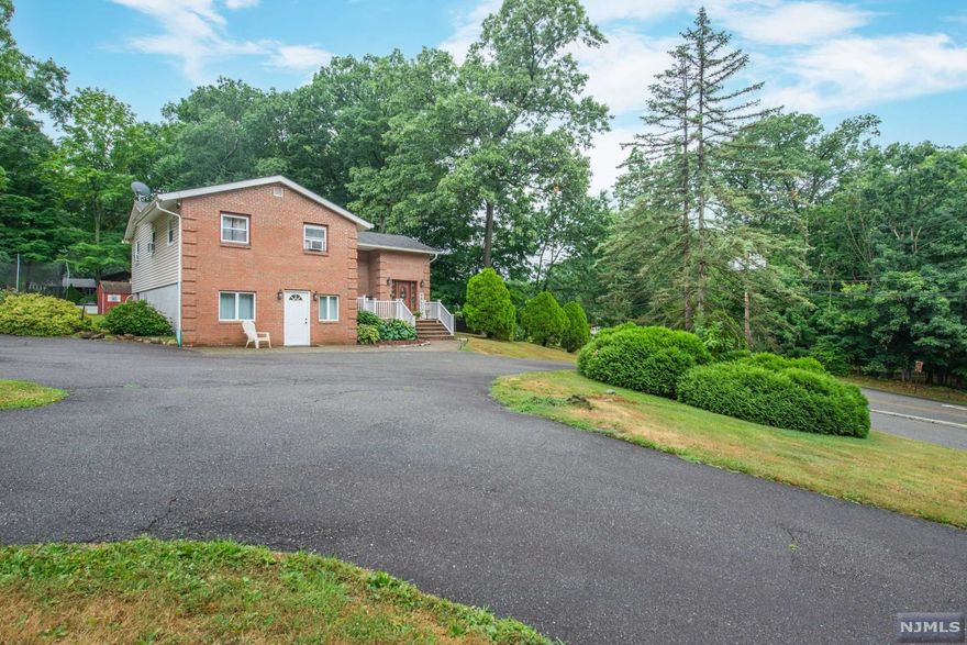 This Custom home offers lots of flexibility for various needs. The Parking is incredible with not only a circular drive but room for 8 to 10 Parking spots. Fantastic for someone with a lot of vehicles, for entertaining or even home office usage. Inside the home there is plenty of hardwood flooring and other neat features. The Living/Dining area has a Large wood burning Fireplace with high ceilings and great views of nearby Mountain Ranges. The Family room on Ground level also offers a wood burning Fireplace and has sliding glass doors leading to the patio and huge Back yard with oversized storage shed. Just off the Kitchen is a great Deck that is ideal for outdoor cooking and has great views as well. Newer Septic and updated well filtration system just installed. Situated close to Lakes, streams, Trails so for any that enjoy Fishing, Boating, Hiking, Biking you are in close proximity to State parklands that can keep you busy for years to come.