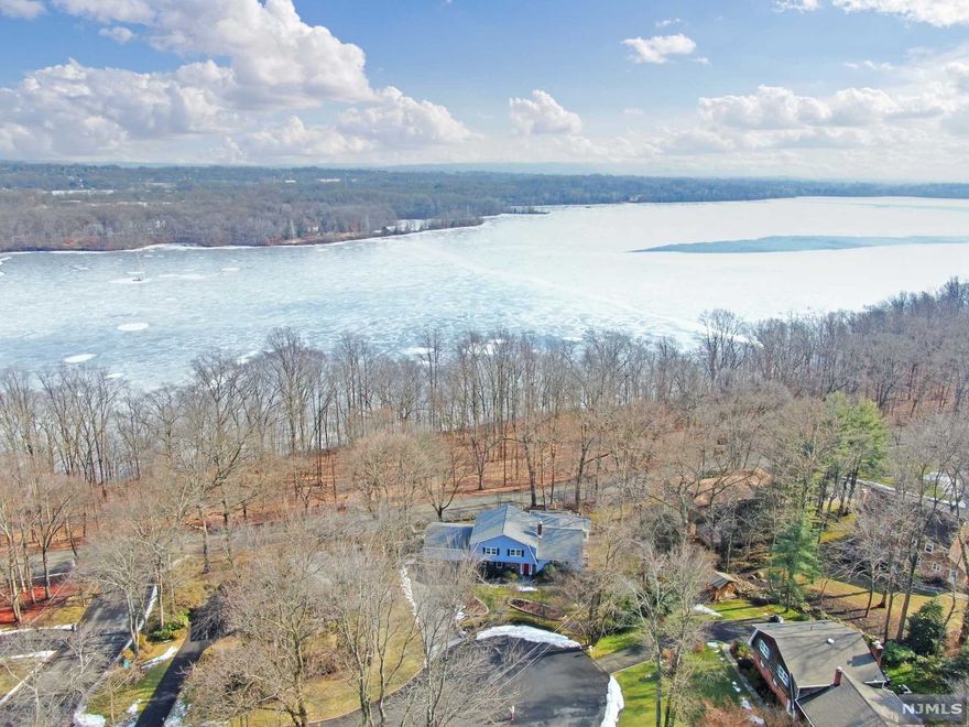 WELCOME TO THIS LOVELY EXPANDED SUGAR MAPLE SPLIT NESTLED ON A QUIET CUL-DE-SAC IN A SOUGHT-AFTER NEIGHBORHOOD OF RIVERVALE. ITS LOCATION OFFERS NATURE AT ITS BEST WITH SPECTACULAR VIEWS OF LAKE TAPPAN AS WELL AS GLORIOUS SUNRISES. FEATURES: HARDWOOD FLOORING ON 1ST AND 2ND LEVEL. LARGE MODERN EAT-IN KITCHEN WITH ALL STAINLESS-STEEL APPLIANCES. OVERSIZED SLIDING GLASS DOORS OFF KITCHEN TO LARGE DECK. TONS OF NATURAL DAY LIGHT WITH BREATHTAKING VIEWS. PROPERTY IS DESIGNED TO ENJOY ALL FOUR SEASONS. PAVER DRIVEWAY, NEW ROOF, SECURITY SYSTEM, NOT TO MENTION CONDUCIVE FOR EXTENDED FAMILY. CALL TODAY FOR A PRIVATE SHOWING. THIS HOME WILL NOT LAST LONG.