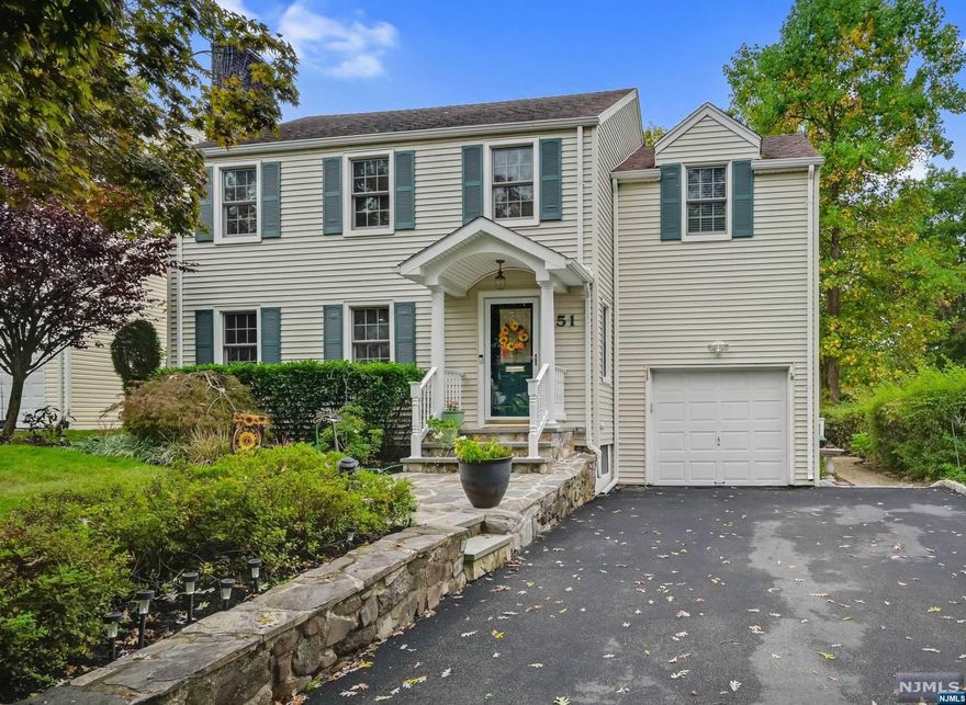 This stunning Colonial home is the opportunity you've been waiting for! Located in a sought-after neighborhood, it features a fresh, neutral color palette throughout. Expansive main level offers updated wood flooring, LR w/fireplace, Formal DR ideal for entertaining, and a bright & airy Family rm w/abundant natural light that opens to rear deck. Updated chef's kitchen boasts stainless steel appliances, incl Thermador 6-Burner Range & an island with 2-seat breakfast bar & prep sink. Laundry rm leads to both deck and the attached garage, and a lg hall provides access to a full bath with stall shower. Upstairs, you'll find 3 generously sized BRs & hall bath with skylight. The finished basement adds extra living space with a recreation/playroom, half bath, storage, & utility area. Private Yard with Deck & Patio. Located close to NYC trans, shopping, schools & more, this well-maintained home is sure to impress! Approx Sq Footage of 2,206 is from 3D Floorplans includes basement rec room