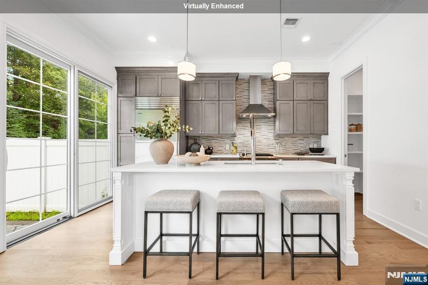 Stunning luxury townhome at Gabriel Estates, a boutique community in the heart of Paramus. Built just a few years ago, this exceptional residence was upgraded to include a rare in-unit private elevator servicing all three levels. The home offers 3 bedrooms, 2 full bathrooms, and 2 half bathrooms, with soaring 10-ft ceilings on the first floor and 9-ft ceilings upstairs, creating an open and airy flow. The gourmet chefâ€™s kitchen is a showpiece, featuring chic cabinetry, Sub-Zero/Wolf appliances, quartz countertops, and sliding glass doors that open to a private backyard. The impressive primary suite includes a spacious walk-in closet and a spa-like bathroom with a soaking tub, large shower, and double vanity. The fully finished lower level expands the living space with a fabulous recreation room and custom wet bar with beverage center, perfect for entertaining. Enjoy outdoor dining and relaxation with the serene patio and fenced yard. All of this just minutes from the Garden State Parkway, Route 17, world-class shopping (Trader Joeâ€™s, Whole Foods, Garden State Plaza, Shake Shack, Container Store, Crate & Barrel, and more), plus access to Paramusâ€™ top-rated schools.