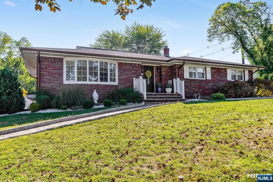 Beautiful and fully renovated ranch style home blending ultimate convenience and modern design. Completely redone in 2020, this residence offers 3 spacious bedrooms and 3 full bathrooms. Inside, elegant crown molding, wainscoting, and an open layout create a warm and inviting flow. The chefâ€™s kitchen features high-end Fulgor Milano appliances, custom cabinetry, and premium finishes, while a 2nd summer kitchen on the lower level adds flexibility for entertaining or extended family. All major systems have been upgraded, including plumbing, electrical, roof, windows, doors, and central air. The garage is fully finished with tiled flooring and sheetrocked walls, offering a polished, functional space. Outdoors, the property becomes a private retreat with multiple patios, a fire pit, and an outdoor kitchen with a brick oven, perfect for al fresco entertaining. A large driveway holds up to 7 vehicles in addition to the attached garage. Paramus is home to top-rated schools, shopping, dining, parks, and major highways. Nothing to do but move in and enjoy this gorgeous and comfortable home. Please note, being sold in AS-IS condition.
