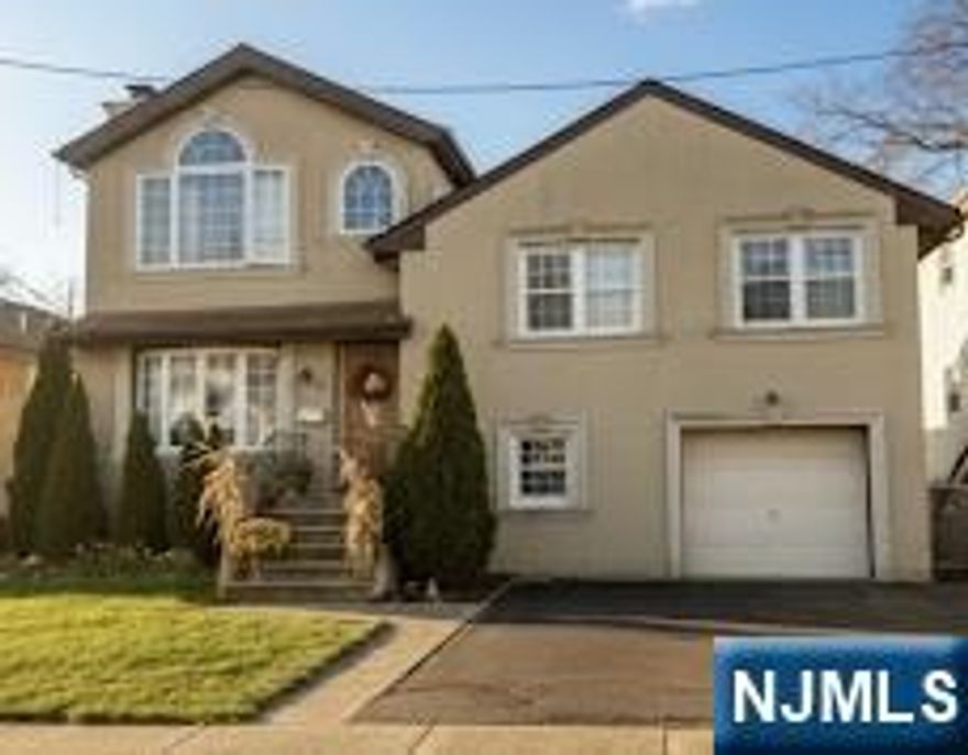 Introducing 224 Division Ave, Garfield, 4 bedrooms, 2.5 baths. Ideally located in the heart of Garfield, just minutes from town, shopping, dining, and transportation. Step into an expanded split-level with a welcoming formal living room featuring a cozy fireplace that sets the tone for comfortable everyday living and entertaining. An open eat-in kitchen flows into the dining area and opens to a deck overlooking the yard, creating a great indoor-outdoor connection. The second floor has 3 bedrooms, a full bath, and plenty of storage area. The third level is bathed in natural light with a half bath, an ideal playroom, an office, or a guest space. The basement is fully finished with a shower and bathroom. Parking garage for added convenience. Great opportunity for buyers and investors. Owner selling with tenants in place.