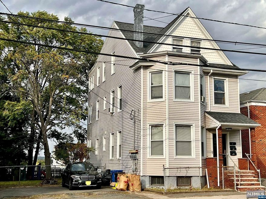 Calling All Investors!! This Spacious Multi-Family Home with Newer Siding, Newer Roof, and Parking for up to 6 Cars is Looking for a New Owner! This Home Features Two 2-Bedroom and One 3-Bedroom Units with Separate Meters, Boilers, and Water Heaters. A Large Unfinished Basement Provides Extra Space for Storage. A Private and Fenced Yard is perfect to Grow your Own Garden or Entertain your Guests. The House is Conveniently Located Close to Places of Worship, Schools, Transportation, and Shopping. Make this Home Yours!