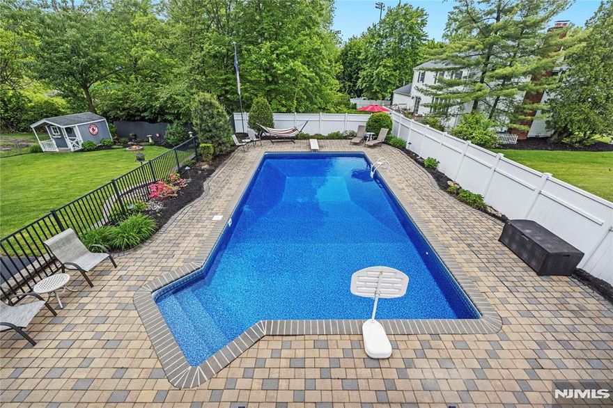 Beautiful classic center hall colonial in amazing location with inground salt water pool and walk-out basement providing extra indoor and outdoor living space. All public utilities. Wood floors, crown moldings, recessed lighting, stainless steel appliances, two gas fireplaces, 6 person hot tub, covered paver patio, Trex deck, SunSetter retractable awning and natural gas grill. 2012 Timberline roof. Central air and multi-zone baseboard heating. Easy access to major highways, shopping, restaurants, parks and schools. First level is complete with entry foyer, formal dining room, formal living room, eat-in kitchen, family room, powder room and laundry room. Second level features primary suite with raised ceiling, walk-in closet and primary bath with jetted tub and shower stall, three additional bedrooms and main bath. Lower level walk-out basement completes this home's space with recreation room, workshop, utility room and storage. Impeccable kept grounds with mature plantings, landscape lighting, extensive paver patio, 18x36 pool, hot tub, basketball and storage shed. Come see this wonderful home today!