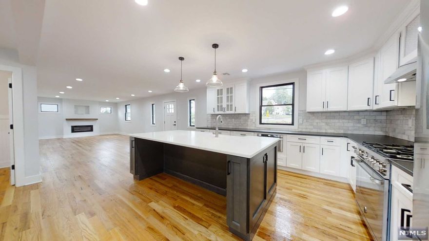 Newly Renovated, gutted to the studs & redone! Nothing left to do except UNPACK! Open Concept Living Space w/ 2 Tone White & Grey Kitchen, Quartz Counters, Stainless Steel Appliances, 2 HVAC Units, Generator, 1st Floor has Liv Rm, Din Rm, Kitchen, Den, Office, Sliding door to a large deck off the dining room, 2nd Floor has an Open Sitting Area that leads to a Balcony overlooking the skyline, Beautiful Master Suite w/ Large Full Bath & Huge Walk in Closet - 3 spacious bedrooms & 1 Main Full Bath, Basement is Finished and perfect as a Recreation Room