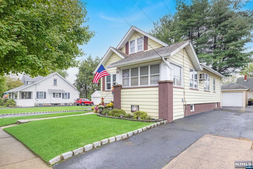 This sun filled home sits on a generous 93 x 100 property . It features 2 detached garages with 2 separate driveways. Enjoy the oversized deck overlooking beautiful yard. The first floor features a large living room, dining room, entertainers kitchen, bedroom and a full bathroom. Upstairs you will find two additional bedrooms boasting extra closet space! The basement offers a rec room, a separate laundry room and a storage room. HVAC is one year old. This home is located close to shops, transportation and top rated schools!