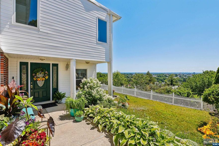 Discover this expansive 4-bedroom, 3-bathroom home with breathtaking views of sunrises and sunsets. Ideal for multi-generational living, the layout includes a spacious first floor with a living room, family room with dining area, kitchen, full bath, and office nook. Upstairs features a large living room with panoramic windows, an eat-in kitchen, a primary en-suite bedroom, 3 additional bedrooms, and another full bath. Hardwood floors throughout the 2nd floor plus recent updates like a 2-year-old AC system, new stove, and dishwasher, offer modern comfort. Experience serene living in this exceptional property. Schedule your tour today!