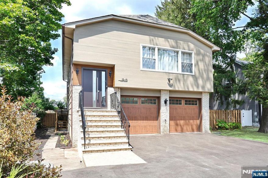 Welcome to this beautifully updated 3-bedroom, 3-bath Bi-Level home with a finished walk-out lower level. The main floor offers a bright, open-concept layout featuring a spacious living room that flows into the dining area and a stunning modern kitchen, complete with high-end Miele appliances including a built-in coffee maker, glass-accent cabinetry, granite countertops, hardwood floors, and a stylish two-level island perfect for casual dining. The primary ensuite is also on this level. The walk-out lower level features two generous bedrooms, a full bathroom, and a comfortable living room with sliders to the backyard oasis. Enjoy summer days by the sparkling inground pool, relax on the patio, or play in the fully fenced lawn area. Additional highlights include a 2-car garage with access to the large basement with a full bathroom, wet bar and separate entrance for extended family. Central vacuum on all levels and a large driveway for ample parking. Perfect for everyday living and entertaining, this home is move-in ready with a new roof and waiting for you! NYC transportation within walking distance.