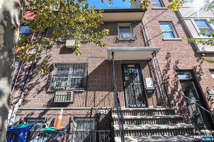 Welcome to 155 Lafayette Street in the highly sought after Ironbound section of Newark. This brick-clad home is a legal two unit residence boasting three floors of living space with 4 sizable bedrooms, 3 full bathrooms, finished basement and a backyard for outdoor enjoyment. Each unit features an eat-in kitchen, living room, in-unit laundry and comfortable living spaces and extra areas for flexible living arrangements. This home serves well for owner occupants or those looking to generate a rental income.This highly desired location is a commuter's dream in every sense. With bus stops just steps from the front door, the major Newark Penn Station transportation hub less than 0.4 miles and easy access to most major highways, this property is a passageway to the local area and beyond. Convenience and entertainment are abundant all around with Ferry Street's delicious restaurants, bountiful shops and vibrant nightlife mere blocks away. Just minutes in every direction leads to schools, houses of worship, several major universities, the Prudential Center, Newark's Business District and Newark Airport.With excellent walkability and endless convenience, this home presents a great opportunity for both investors and owner-occupants looking to live in one of Newark's most desirable neighborhoods.