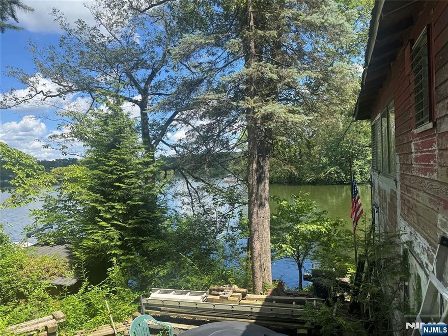 Bring your contractor and your imagination to transform this charming 3 bedroom, 1 bathroom Ranch nestled on the shores of Glen Wild Lake. This unique opportunity offers stunning lake views and the chance to create your dream home in a truly special setting. The main living area features a comfortable living room, dining room ideal for entertaining, and a kitchen ready for your vision. Three bedrooms and a full bathroom complete the first floor. A full unfinished basement offers endless potential to expand your living space, while the 2-car detached garage provides convenient vehicle or equipment storage. Enjoy the beauty and lifestyle of lakefront living kayaking, swimming, fishing, and gathering with neighbors in this vibrant lake community. With solid bones and timeless charm, this home is ready for your updates and personal touch don't miss this rare lakefront opportunity.