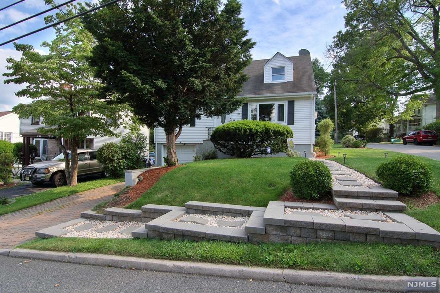 Low Taxes!!! Beautifully well maintained home with four bedrooms, 2 full baths and a powder room on a quiet street with easy NYC commute. First floor offers an open space plan with living room, dining area, updated kitchen, two bedrooms and a full bath. On the second floor, there are two more good sized bedrooms and a full bath. Lower level is fully finished with a family room and powder room. Enjoy the large fully fenced backyard. Attached 1 car garage. It will not last! Call today for a showing. Thank you.