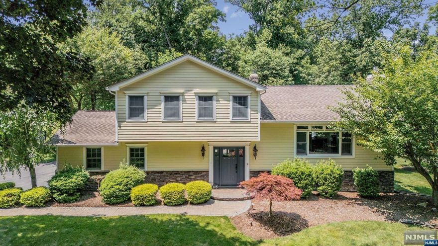 A must see! Step inside this beautiful renovated home, located on a great street in the picturesque town of Wyckoff! First floor features living room with fireplace, dining room, open concept Eat-in-kitchen, family room, laundry and half bath. Second floor features Master suite with full bath, two additional bedrooms and full bath. Home also features full finished basement with additional large family room and private home office. Sliding doors off the kitchen take you out to a large deck, complete with pavered patio area with fire pit and huge private backyard for your very own private oasis and is perfect for entertaining! Amenities include hardie board siding, 3 zone heat, central air, 6 zone sprinkler system, two car garage, hardwood floors and so much more! Updates include newer electric, boiler, central air, hot water heater, water softener and home was recently hooked up to public sewer system! Nothing to do but pack your bags and move in! This home will not last!