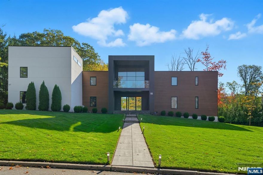 Set on one acre at the end of a private cul-de-sac, 55 Oxford Drive is one of Tenaflyâ€™s most prestigious residences. Built as a forever home and fully renovated in 2023, this approximately 11,000 sq ft estate blends contemporary design with exceptional craftsmanship. Featuring 6 ensuite bedrooms, 7 full and 2 half baths, the home offers 10 inch wide flooring, custom solid doors, 5 fireplaces, a designer chefâ€™s kitchen with Gaggenau, Sub Zero and Wolf appliances, a temperature-controlled wine room, and a custom primary closet. Designed for elevated living and entertaining with a private theater, sauna, indoor basketball court and indoor turf field. Resort style grounds include a new Gunite pool, spa, marble patio, outdoor kitchen, sound system and outdoor turf sports court. Smart home throughout with new roof, HVAC, generator and solar panels.