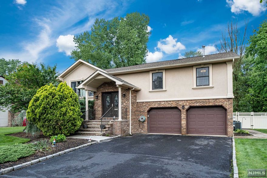 Truly turn-key 4 bedroom 4 bathroom gorgeous home situated on the desirable east side of Paramus with a RESORT-LIKE backyard and inground pool! Absolutely stunning renovations and updates throughout. Oversized floor plan features over 3,500 sq ft of living space. The main level boasts an open-concept layout with a beautiful brand new kitchen with SS appliances, quartz countertops, center island and breakfast bar. Huge living and dining spaces. Deck off of the dining room to enjoy indoor/outdoor living and entertaining. Primary Bedroom is so spacious with en-suite bathroom and W.I.C. Lower Level DREAM entertainment space with wet bar, family room, full bathroom, and guest room. Park-like property is nearly 1/2 of an acre. So many upgrades include central vac, 2 zone HVAC, oversized 2 car garage, and more. Paramus is home to low taxes, excellent schools, and shopping galore. You Must See This Home! HIGHEST AND BEST BY TUESDAY 6.7 @ 5pm!