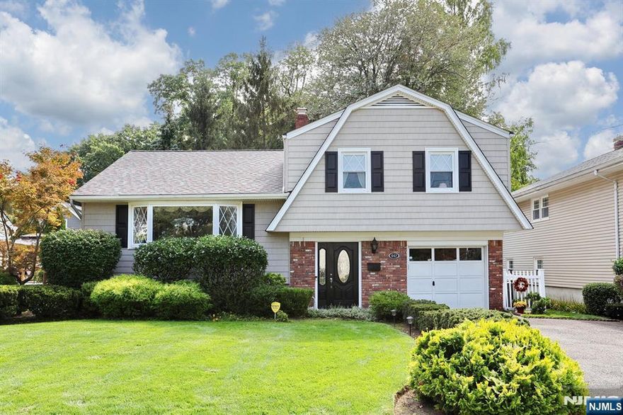 IMMACULATE AND WELL MAINTAINED 9 ROOM, 4 BEDROOM EXPANDED SUGAR MAPLE SPLIT! LOVINGLY CARED FOR BY THE ORIGINAL OWNER! THIS HOME FEATURES: BEAUTIFUL FOYER ENTRY, LARGE LR WITH BAY WINDOW, FORMAL DINING ROOM, GLEAMING HARDWOOD FLOORS, EXPANDED KITCHEN WITH MANY CABINETS AND LARGE SEPARATE DINING AREA, ENTRANCE TO COMPOSITE DECK AND PRIVATE YARD. 4 GENEROUS SIZED BEDROOMS WITH HARDWOOD FLOORS. FAMILY ROOM PLUS A DEN/OFFICE WITH S/G/D TO YARD. CONVENIENT GRADE LEVEL LAUNDRY AND HALF BATH. FINISHED BASEMENT, WITH WORK AREA AND STORAGE. UPDATED VINYL SIDING AND WINDOWS, ROOF 5 YRS OLD,1 YR OLD HOT WATER HEATER, UPDATED FURNACE, C/A/C. PROFESSIONALLY LANDSCAPED PROPERTY! CONVENIENT LOCATION TO TRANSPORTATION! END YOUR SEARCH! EXCELLENT VALUE!!