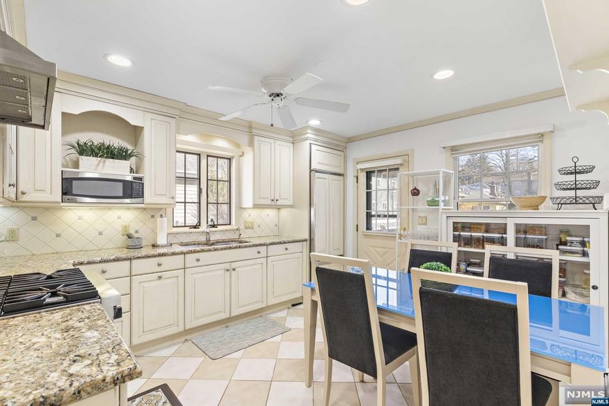 Welcome Home! Don't miss this METICULOUSLY maintained & expanded cape cod home! Highlights include a luxury renovated "Ulrich" eat-in kitchen with Viking range/Sub-zero fridge/custom panel D/W & granite counters, a first flr primary suite (also perfect as a fam rm, formal DR or office) addition with vaulted ceilings, an en-suite full bthrm and sliders to deck! Three add'l BRs and second full bthrm including a king-sized BR on the 1st floor with California closet, charming entry foyer/mudroom and sun-filled LR/bay window. Other features include a clean, high & dry, professionally waterproofed basement, a whole house Generac generator & updated 150 amp electric. Perfectly manicured and fenced yard/shed and updated exterior with newer roof/driveway/steps offer great curb appeal! Conveniently located on the Maywood border within close walking distance to express NYC transportation, local shopping and Borg's woods for nature walks! Truly a gem not to be missed!