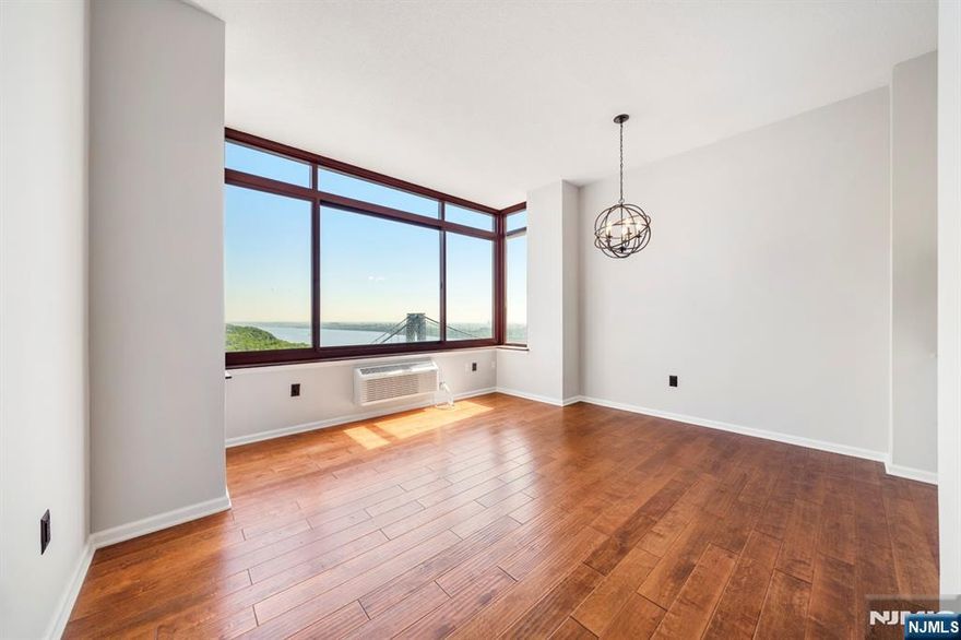 Welcome to your dream home in the sky. This beautifully renovated 1 bedroom, 1 bath penthouse condo at The Palisades offers sophisticated city living w/an unbeatable view. Perched on the top floor, this residence boasts soaring ceilings, gleaming hardwood floors, and brand-new appliances, blending modern elegance with comfort. Wake up to sweeping vistas of the Hudson River and the iconic George Washington Bridge-your daily backdrop through oversized windows that flood the space with natural light. The Palisades is a full-service luxury building featuring a 24-hour doorman, concierge, fitness center, outdoor pool with BBQ area, and on-site management for peace of mind. Enjoy the added convenience of an in-unit washer/dryer, plus your own indoor parking space. Ideally located near NYC transportation, premier dining, Hudson Lights Town Center, and Movie Theater, this home offers both upscale tranquility and vibrant urban access. Live above it all-experience refined living at The Palisades.