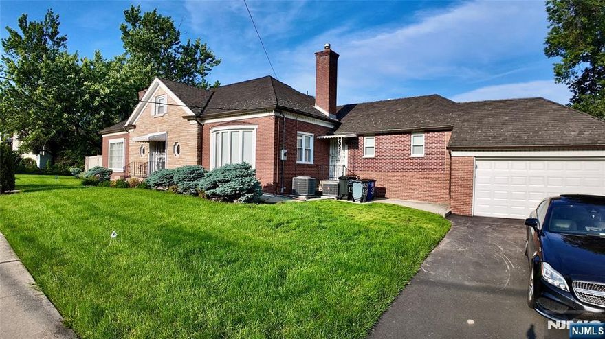 Spacious brick home blending vintage charm with modern updates, just 15 minutes from NYC and near Routes 20, 80, 21 & 46. Features include hardwood floors, central air, smart thermostats, spiral staircase, and updated baths. The first floor offers a large foyer, living room with porch access, formal dining room with bay window, master suite, and eat-in kitchen. Upstairs boasts two large bedrooms with cedar walk-in closets and a full bath. The fully finished walk-out basement includes a rec room, office, bar area, laundry, and additional bed/bath suite. Two-car garage and fenced yard complete this move-in-ready gem.