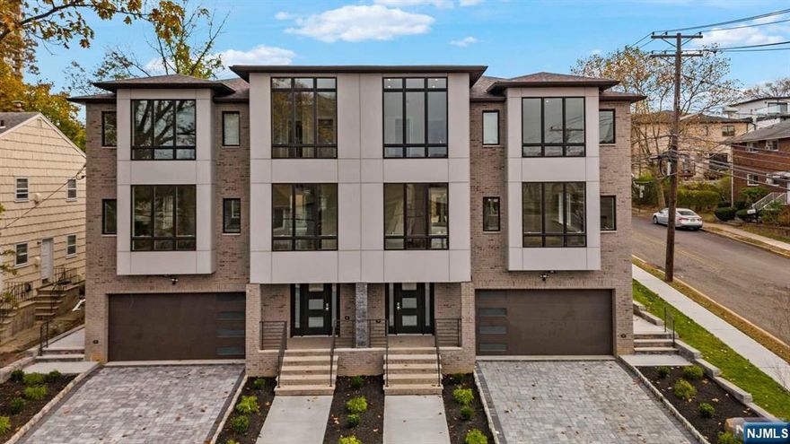 Nestled in the coveted School District #2, this stunning 5-bedroom, 5-bathroom, 3-level townhome is ideally set on a sprawling 75x100-foot corner lot. Offering the perfect balance of luxury and practicality, 427 North provides easy access to New York City with a dedicated home office, a two-car garage, and a welcoming ground-floor entrance. The expansive corner lot gives the home the charm and space of a single-family residence, while retaining the convenience of townhome living. Inside, you'll find a chef's gourmet kitchen with a separate detached pantry, seamlessly integrated smart home technology, and a spa-inspired master suite complete with a luxurious bath retreat. The inviting backyard is perfect for relaxation and entertaining, offering a peaceful oasis in the heart of the neighborhood. Located just steps from Main Street, you'll enjoy proximity to transportation, schools, places of worship, and some of the area's best local restaurants.