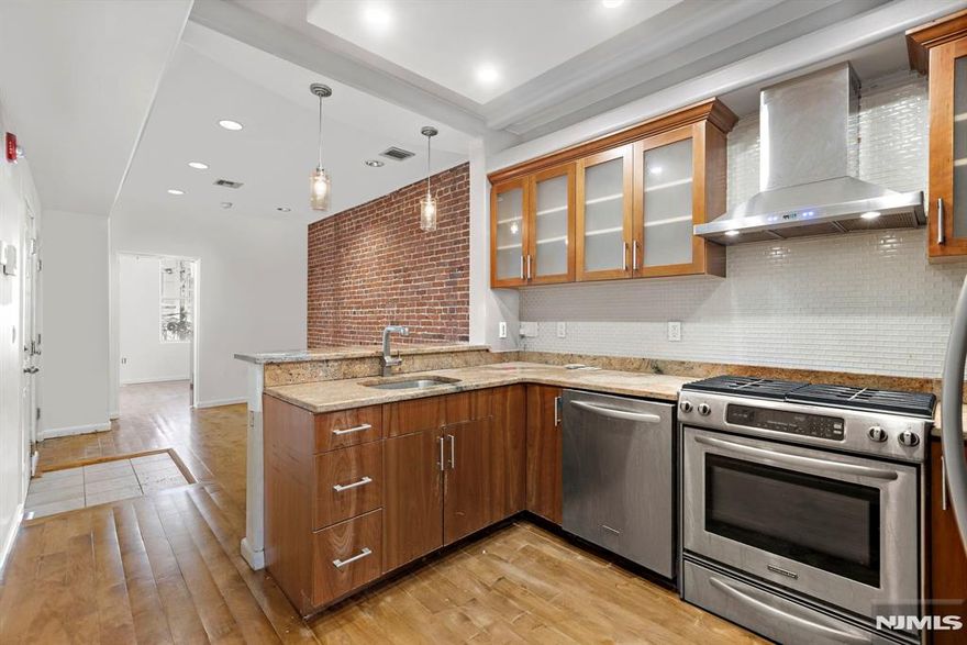 **OH - Sat (3/14) 10am - 12pm | Sun (3/15) 1PM - 3PM** Charming 2 bedroom in highly desirable midtown Hoboken location. Chefâ€™s kitchen includes granite countertops, stainless steel appliances, subway tile backsplash, and a breakfast bar. Two spacious & sunny bedrooms with custom closets. The bathroom has a jacuzzi tub, custom cabinets & shelves, and granite vanity. The home also features exposed brick, hardwood floors, recessed LED lighting with dimmers, central A/C, and an in-unit washer/dryer. Private storage in basement included. Conveniently located near the Path, Light Rail, bus stops and everything Hoboken has to offer. Rental parking is available across the street.