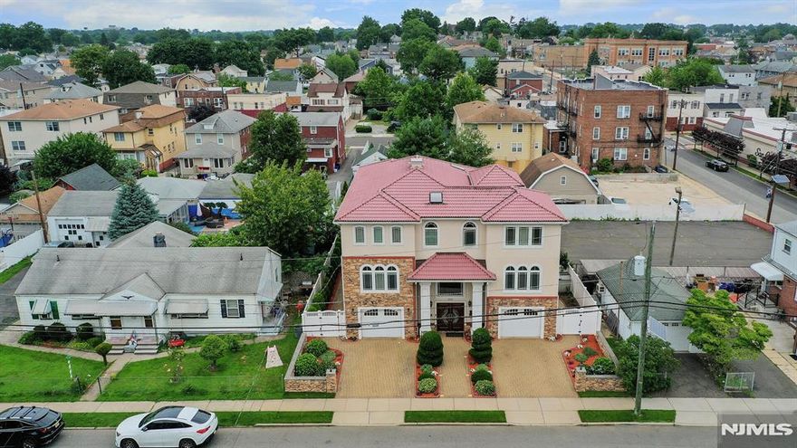 Beautiful, Sunlit 2 bedroom- 2 full bath apartment with Open-Concept Layout. Laundry Room w Washer & Dryer and an additional room perfect for an office. Kitchen includes all Stainless Steel Appliances, Center Island, Tiled backsplash, and plenty of cabinets for storage. Family Room- Gas fireplace. Private balcony for fresh air or your morning coffee. Master suite features tray ceiling, recess lighting, fan, walk-in closet and full tiled bathroom w hot tub, dual sink, stall shower, linen closet & skylight. Central Vacuum, Central AC, Forced Hot air, Gleaming Hardwood Floors & Tiled Baths. Additional Storage in a pull-down attic. A prime location near NYC transportation, Shopping, Parks and Top Rated Schools!
