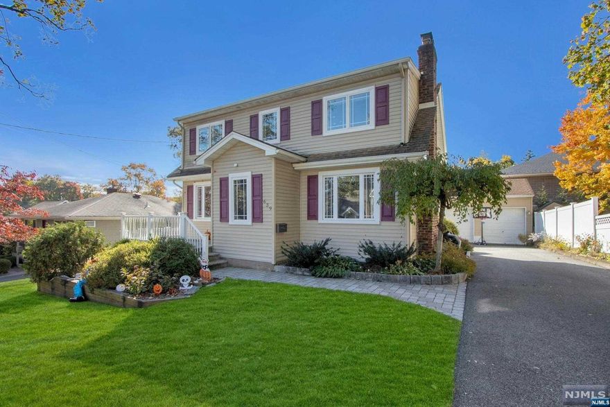 Beautiful Move-in Ready Colonial with a Modern Open Floor Plan in Washington Township! The large and bright living room includes a stone fireplace and is open to the spacious dining room. The modern kitchen features white cabinets, granite countertops and French doors to the backyard. A half bath and mudroom completes the first level. The second level features a large bedroom with a custom closet. Two spacious bedrooms and a modern full bath completes the second level. The fully finished lower level offers a large recreation room, storage and laundry. Lush, professionally landscaped property includes a fenced-in backyard with a large deck, great for entertaining! The oversized 2-car detached garage features high ceilings. Close to schools, parks, NYC transportation and shopping. Don't miss this gorgeous home!