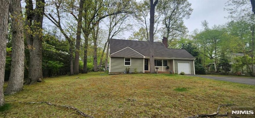 Great location on large level lot 100 x 124! Cape cod, features entry foyer, large living room with wood burning fireplace opens to large eat in kitchen. Formal dining room with entry to lovely 3 season porch. Two large bedrooms on first floor. Newer full bathroom first floor. Upstairs 2 large bedrooms and full bathroom. Fenced yard. Full unfinished basement with high ceiling, great potential. One car garage. Huge driveway with plenty of parking. A must see to appreciate!