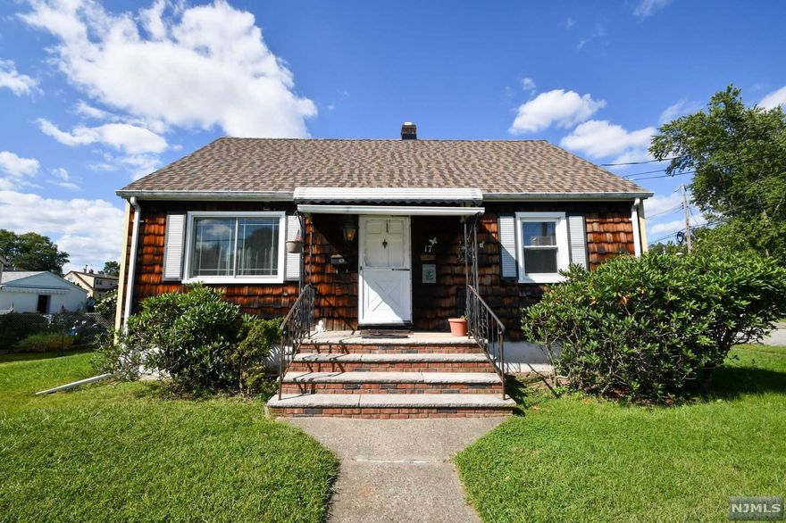 Cape Cod with a new roof sits on well manicured property on a level corner lot. A bright entryway welcomes you to this sunny home with new hardwood floors and floods of natural light. The living room features a new picture window with views of the wooded lot across the street. Easily prepare meals in the eat-in-kitchen complete with granite countertops, a gas stove, recessed lighting, and an attached dining area. A 3 season sunroom with wall-to-wall windows offers access to the backyard. 2 sunny bedrooms are opposite a recently renovated bathroom with a tub shower. Upstairs versatile bonus rooms can serve as an office, playroom, or bedrooms. The lower level houses a laundry area and storage/utility space. Unwind in the fully fenced backyard. This home is conveniently located and ready to be enjoyed.
