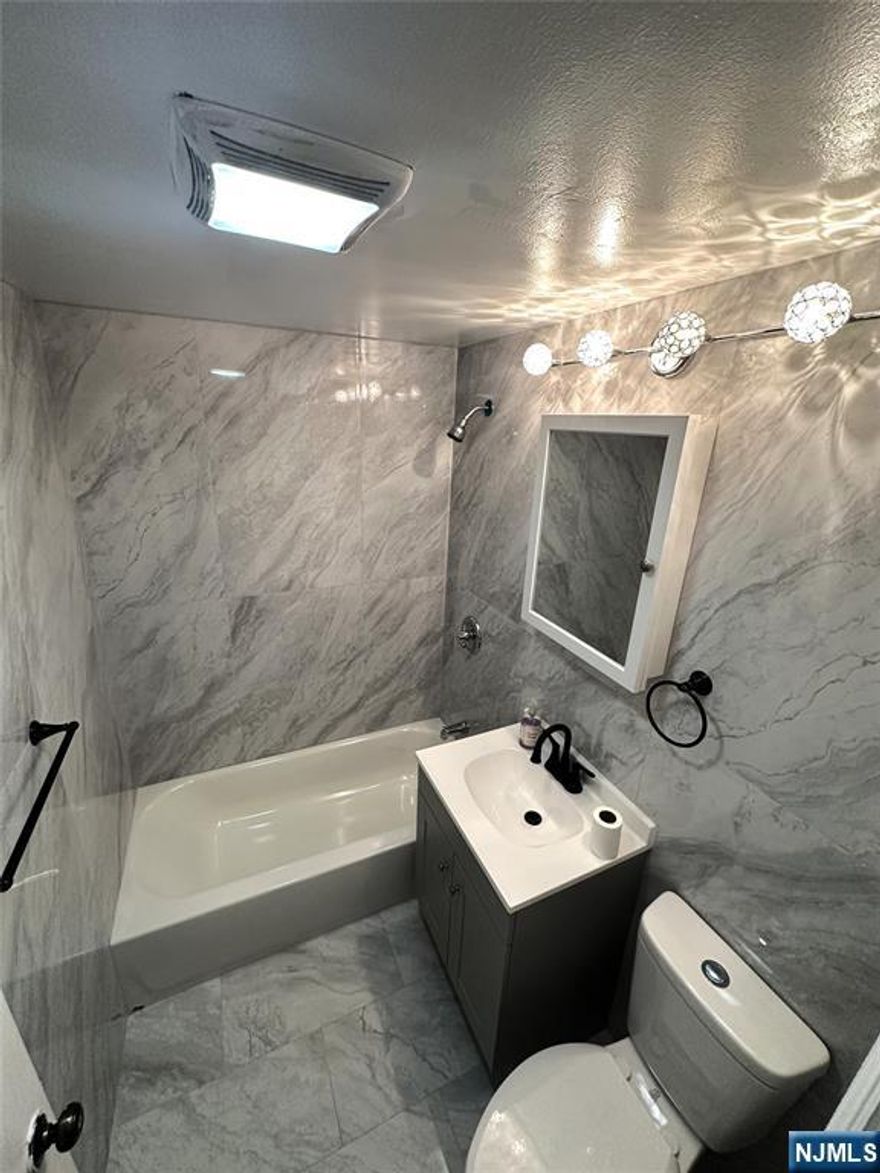 Renovated second-floor apartment located just 10 minutes from NYC. This well-maintained unit is in excellent condition and offers a comfortable and functional layout. The apartment features a newly renovated bathroom and a spacious kitchen, providing an ideal space for everyday living. The three bedrooms are pleasant and inviting, offering a comfortable atmosphere for rest, work, or relaxation. Natural light fills the apartment, allowing you to enjoy beautiful sunset views and creating a warm and welcoming ambiance. Situated in a quiet and peaceful neighborhood, the property is conveniently located close to shopping, schools, places of worship, and public transportation, making it an excellent option for commuters and those seeking both comfort and accessibility.