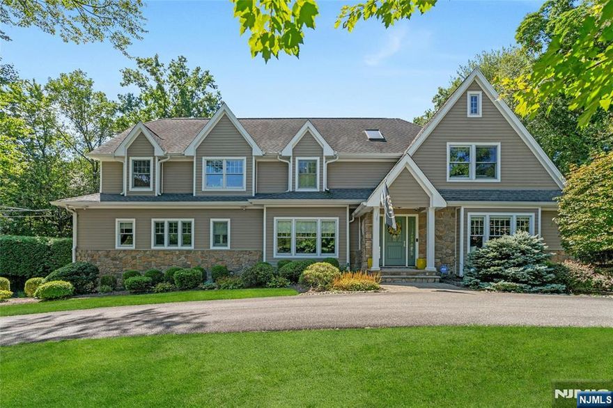 Welcome to 7 Deerhill Drive, a stunning modern Colonial offering 5 bedrooms, 5 full baths, and 1 half bath, blending timeless design with modern comfort throughout. An open-concept layout is ideal for everyday living and entertaining, featuring a gourmet kitchen with oversized island, coffee bar, and eat-in area that flows seamlessly into the inviting living room with a natural stone fireplace. Formal living and dining rooms, along with a flexible main-level space with full bath, add both elegance and versatility. Upstairs, the luxurious primary suite offers a serene retreat with an expansive walk-in closet, accompanied by three additional guest bedrooms designed for comfort and flexibility. A bonus room offers flexible space for a playroom, office, or additional lounge area. The walk-out lower level enhances the homeâ€™s appeal with a recreation area, wet bar, full bath, and access to the 3-car garage. Outdoors, a private backyard oasis awaits, featuring mature landscape, an in-ground pool, outdoor fireplace, and built-in grillâ€”perfect for entertaining and enjoying the best of indoor-outdoor living. A lifestyle waiting to be experienced!