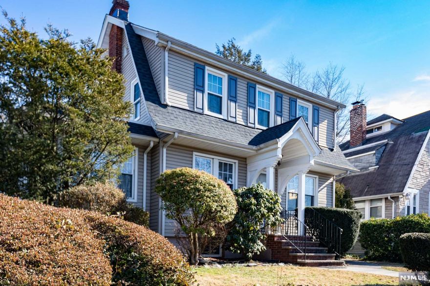 Charming and well maintained Colonial home in lovely neighborhood close to Teaneck border. Beautiful hardwood floors, stained glass window. Wood burning fireplace in Living Room. Sunny Family Room or Home Office. Formal Dining Room. Eat in Kitchen. Master Bedroom with custom double closet. Updated bathrooms. Nicely finished Basement with Rec Room/Craft Room, Utility Room and Storage. New roof. Fenced backyard includes deck off kitchen and paver patio. Large shed. Located close to NYC transport, parks, shopping and houses of worship. Fantastic opportunity. Not to be missed !